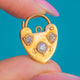 Gold heart padlock with a central Diamond and Diamond-set shields