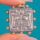 Silver iris locket with Rose Gold-covered studs, iris and flowing line relief on the locket front