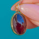 Pendentif en grenat cabochon serti clos en or 9 carats