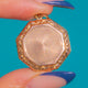 Octagonal Gold back-and-front locket with radiating machine engraving